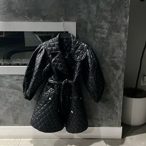 Black very light weight coat with puffy sleeves never used no tags bought $100